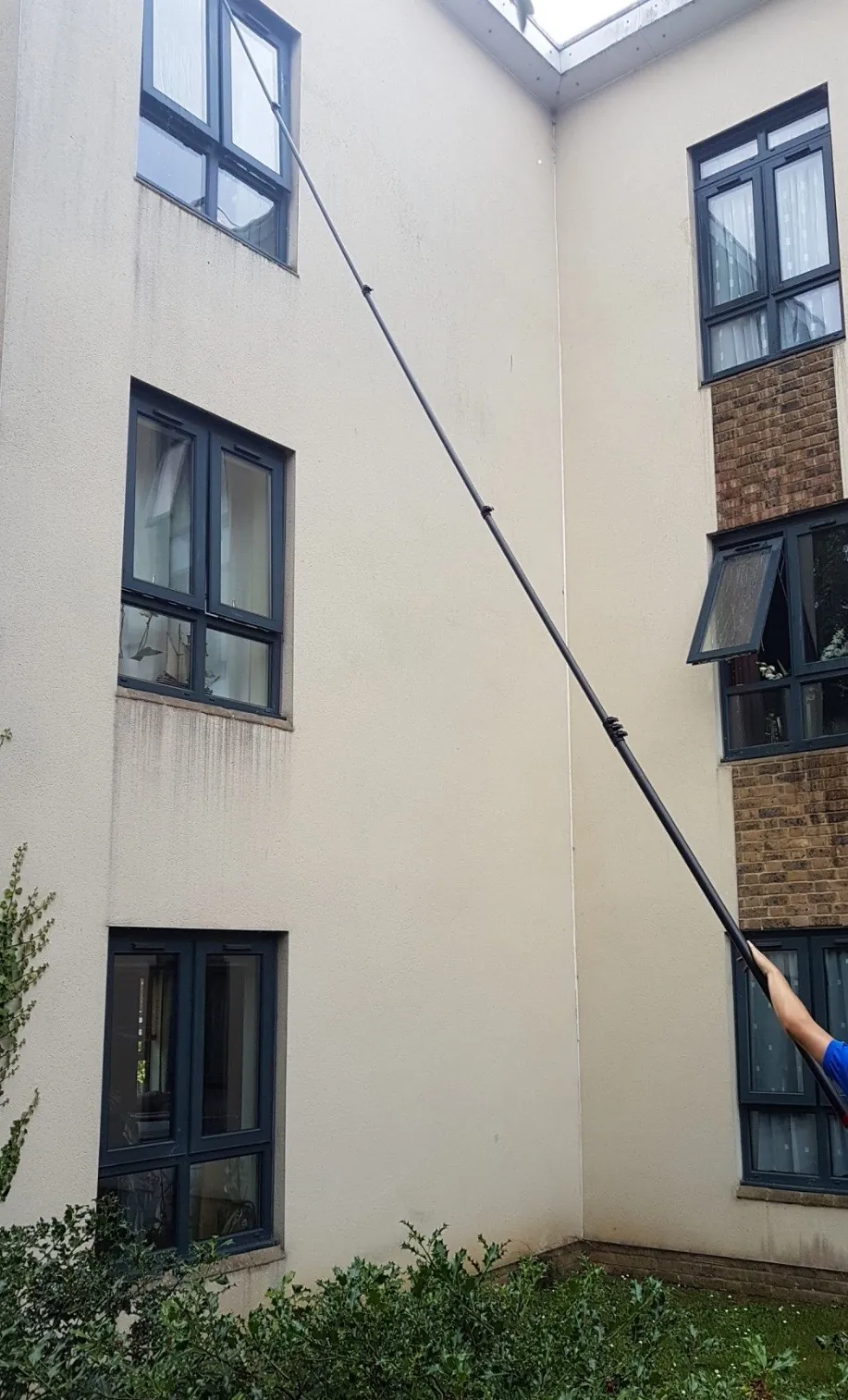 Reaching 3rd floor windows with a carbon pole