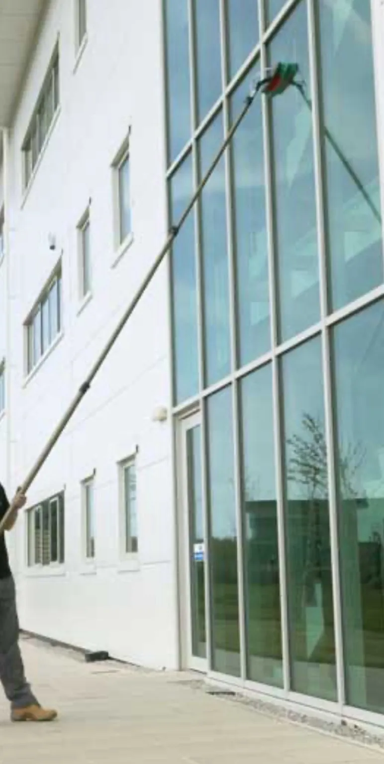 Commercial glass facade cleaning with pole